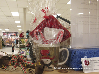 Jean McGrath has this gift mug filled with candy canes, hot cocoa, and a mug coaster