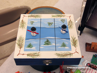 Tic-tac-toe game with snowman game pieces