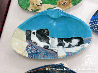 Dog painted on a shell