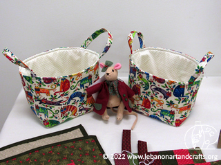 Tote bags and a member of the Woodlander doll series