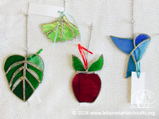 Monsterra, ginko leaf, apple, and hummingbird ornaments/sun catchers