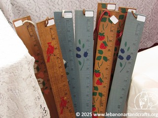 Stenciled snow measuring sticks